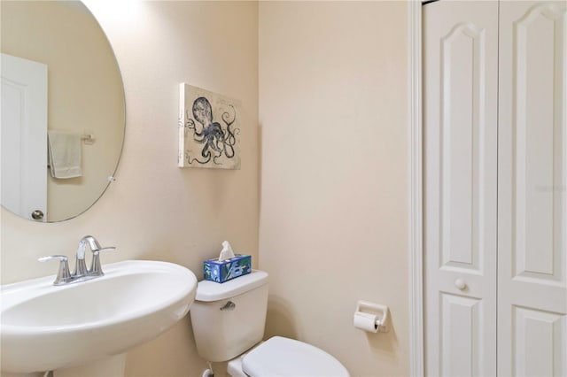 bathroom with toilet and sink