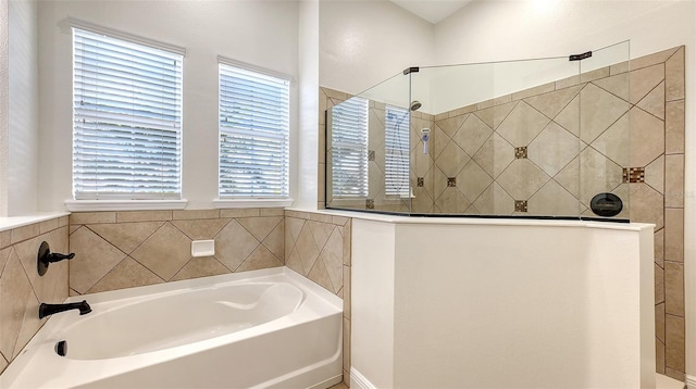 bathroom featuring plus walk in shower