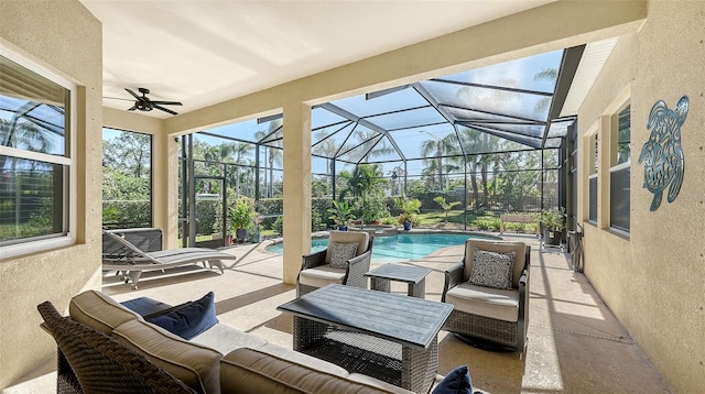 view of patio / terrace with outdoor lounge area, ceiling fan, and a lanai