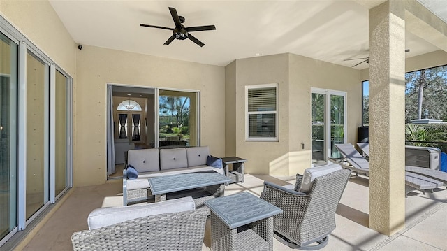 view of patio with outdoor lounge area and ceiling fan