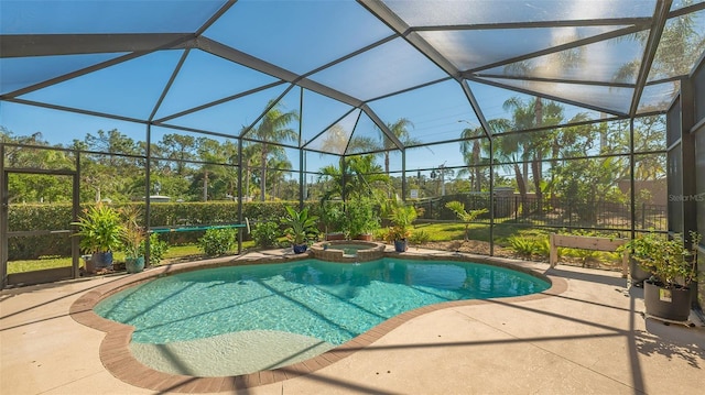 view of swimming pool featuring a lanai, an in ground hot tub, and a patio