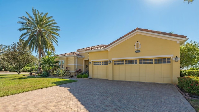 mediterranean / spanish home featuring a front yard