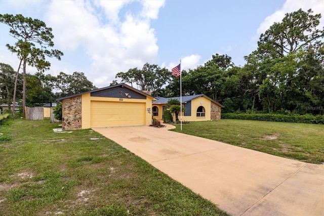 single story home featuring a garage and a front yard