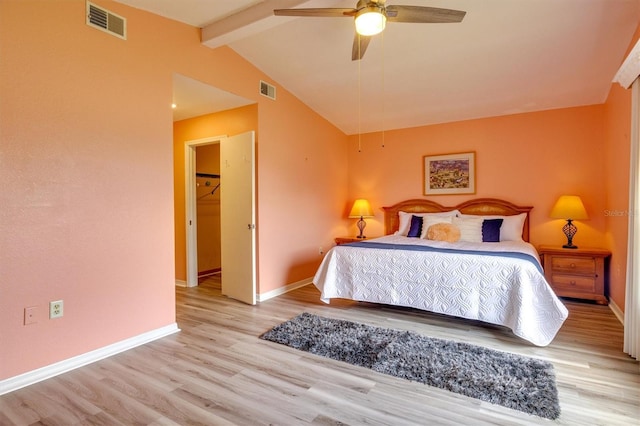 bedroom with vaulted ceiling with beams, ceiling fan, and light wood-type flooring