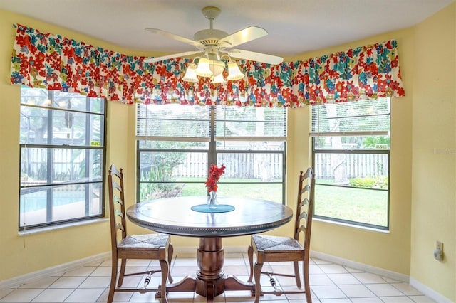 dining room featuring ceiling fan and light tile patterned flooring