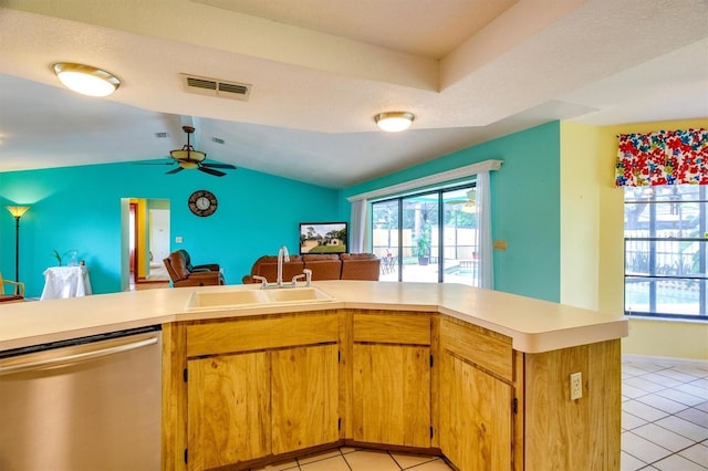 kitchen with kitchen peninsula, stainless steel dishwasher, a textured ceiling, ceiling fan, and sink