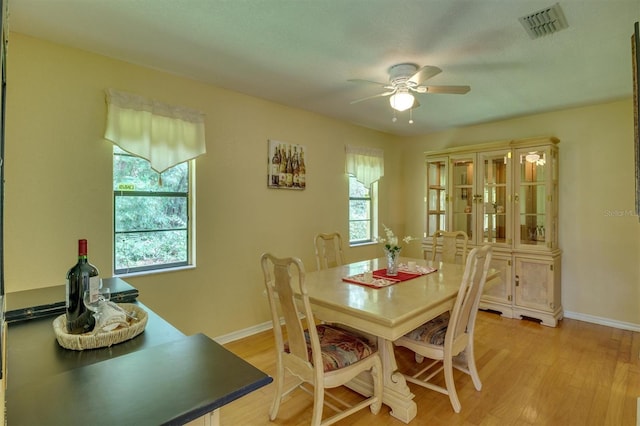 dining room featuring ceiling fan and light hardwood / wood-style floors