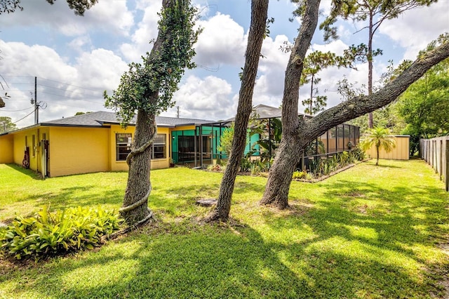 view of yard featuring a storage unit