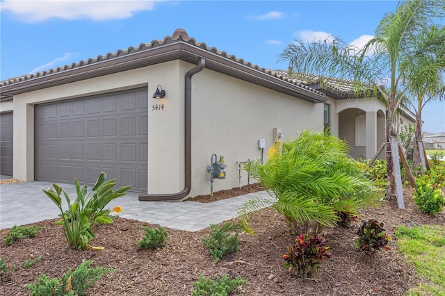 view of property exterior with a garage