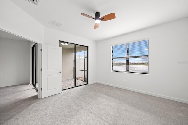 unfurnished bedroom featuring ceiling fan and light colored carpet