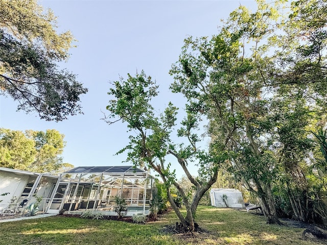 view of yard featuring a lanai