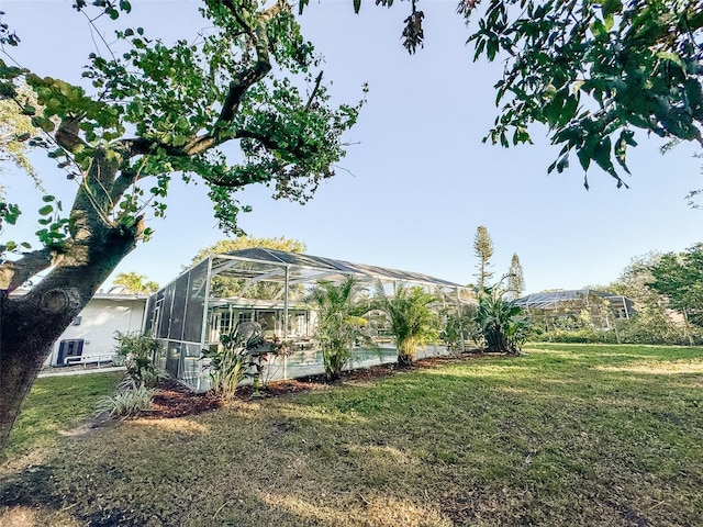 view of yard with a lanai