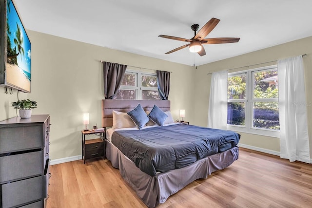 bedroom featuring ceiling fan and light hardwood / wood-style floors