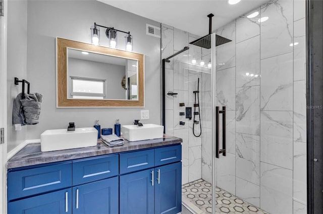 bathroom featuring vanity and an enclosed shower