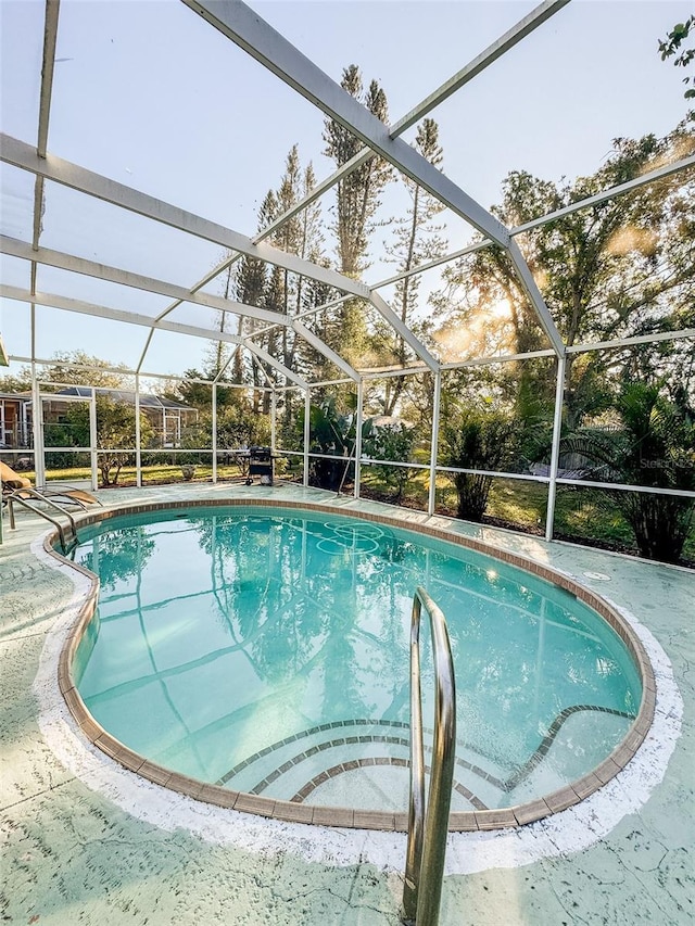 view of pool featuring a lanai