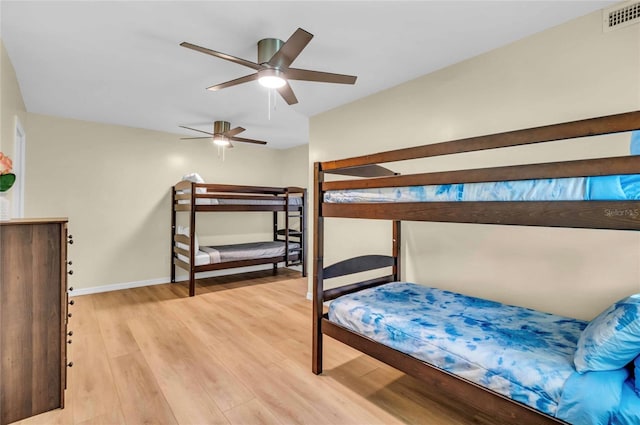 bedroom featuring ceiling fan and light hardwood / wood-style floors