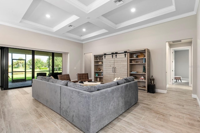 living room with coffered ceiling, a barn door, light hardwood / wood-style flooring, beamed ceiling, and crown molding