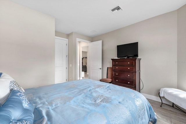 bedroom with light wood-type flooring