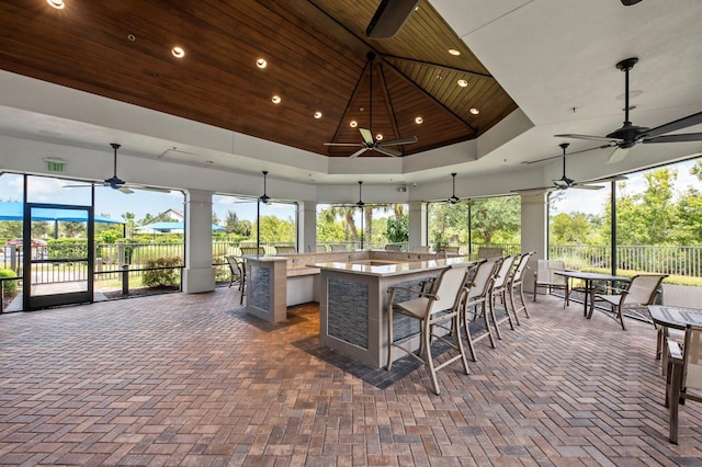 sunroom / solarium featuring wooden ceiling