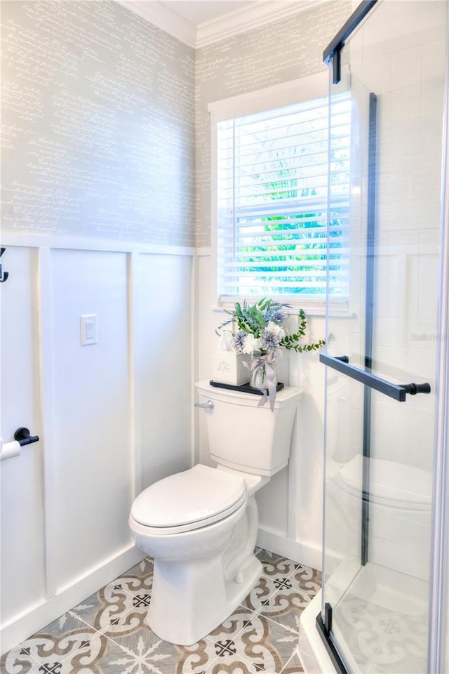 bathroom with tile patterned flooring, a shower with shower door, and toilet