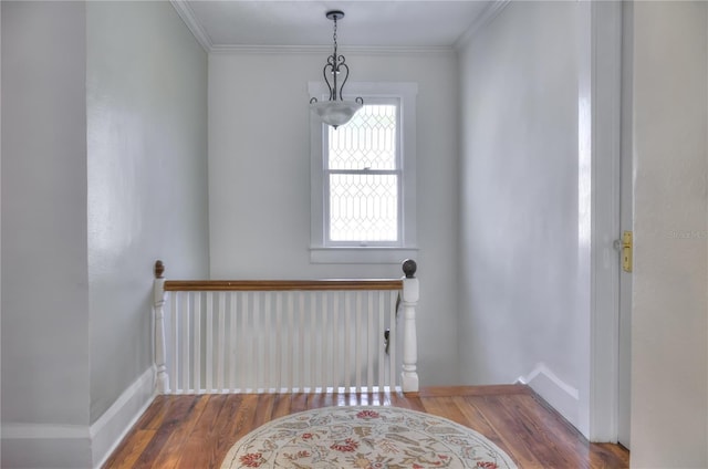 living area with hardwood / wood-style flooring and ornamental molding