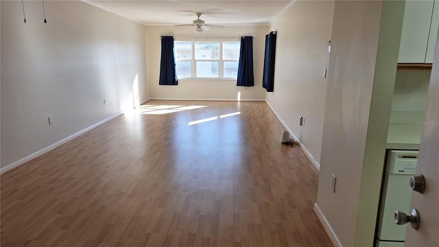 unfurnished room with ceiling fan, ornamental molding, and hardwood / wood-style flooring