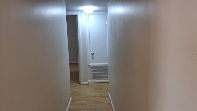 hallway with light wood-type flooring