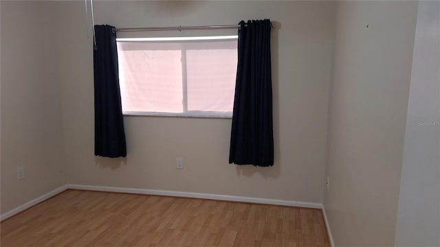 unfurnished room featuring light hardwood / wood-style flooring