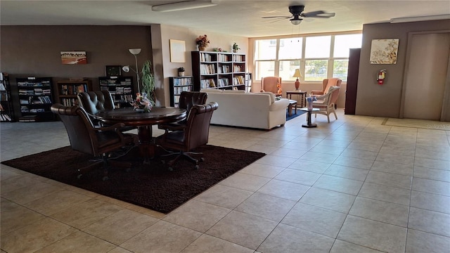 tiled dining area featuring ceiling fan