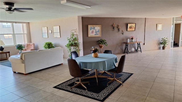 tiled dining area featuring ceiling fan