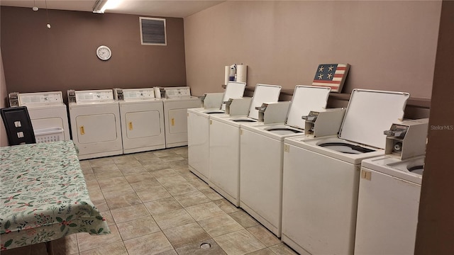 laundry area with washing machine and clothes dryer