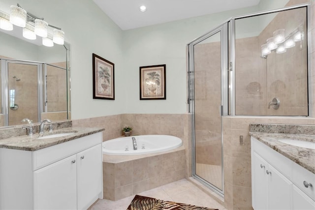 bathroom featuring tile patterned floors, vanity, and plus walk in shower