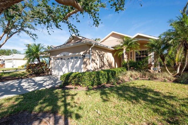 view of front of home featuring a front yard and a garage