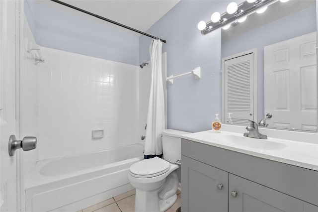 full bathroom with tile patterned floors, vanity, shower / tub combo, and toilet