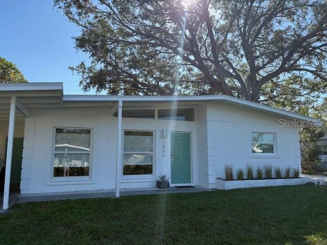 exterior space with a lawn