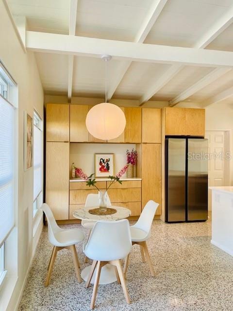 dining room featuring beam ceiling