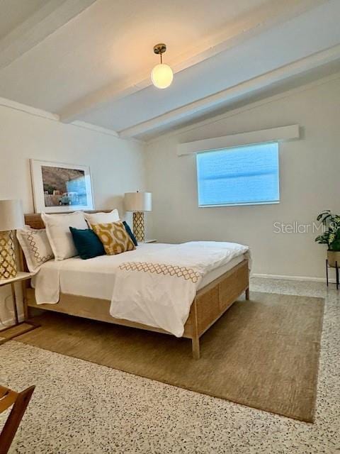 bedroom with lofted ceiling with beams