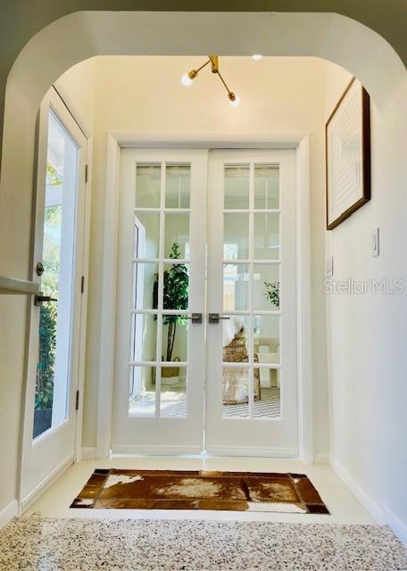 doorway with a healthy amount of sunlight and french doors