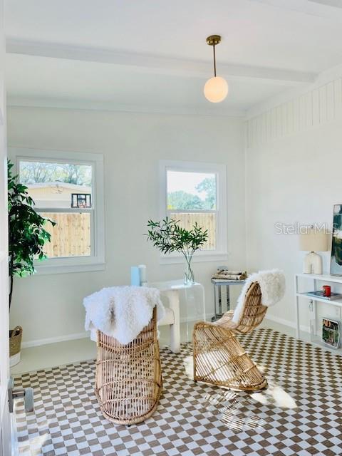 sitting room with beamed ceiling