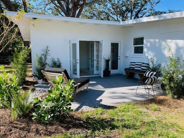 back of property featuring a patio area and french doors