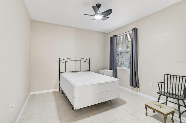 bedroom with light tile patterned floors and ceiling fan