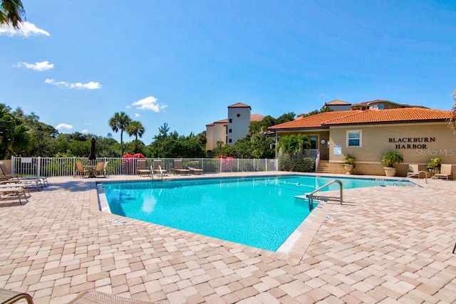 view of swimming pool featuring a patio