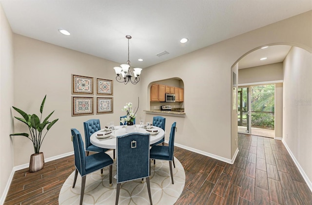 dining area featuring a notable chandelier