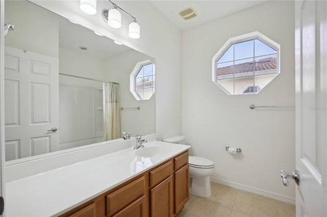 bathroom with tile patterned floors, vanity, a shower with shower curtain, and toilet