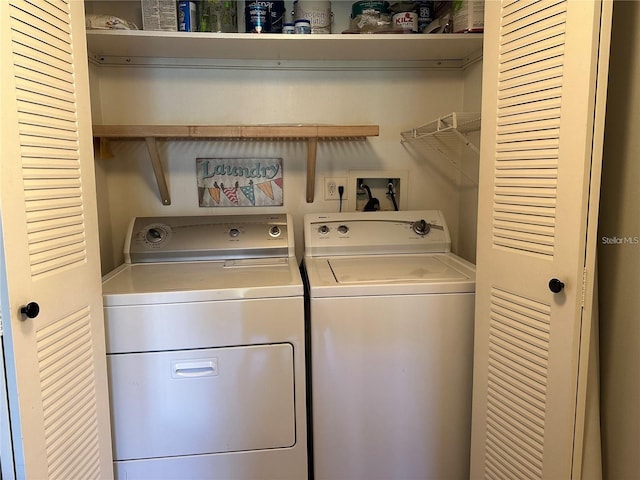 washroom featuring washer and clothes dryer