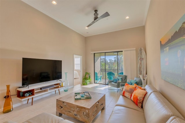 living room with ornamental molding, ceiling fan, and light tile patterned flooring