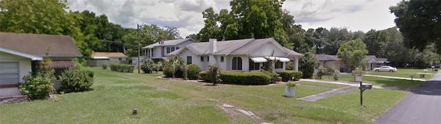 view of front of house with a front lawn