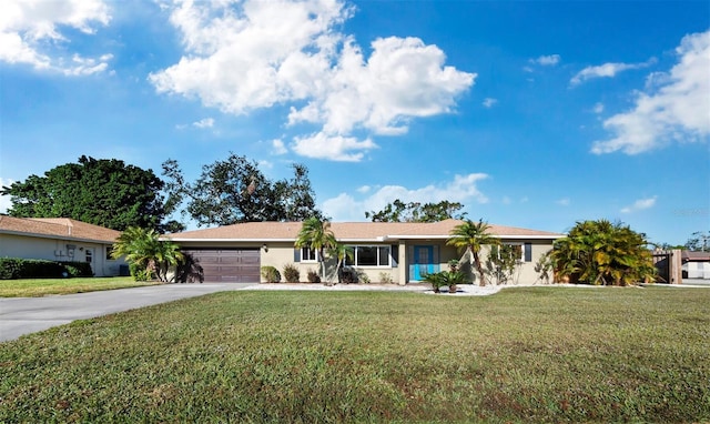 single story home with a garage and a front yard