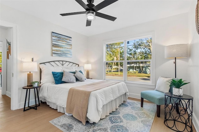 bedroom featuring light hardwood / wood-style flooring and ceiling fan