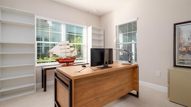 tiled home office featuring a wealth of natural light